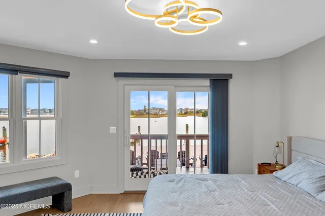 a bedroom with furniture and a wooden floor