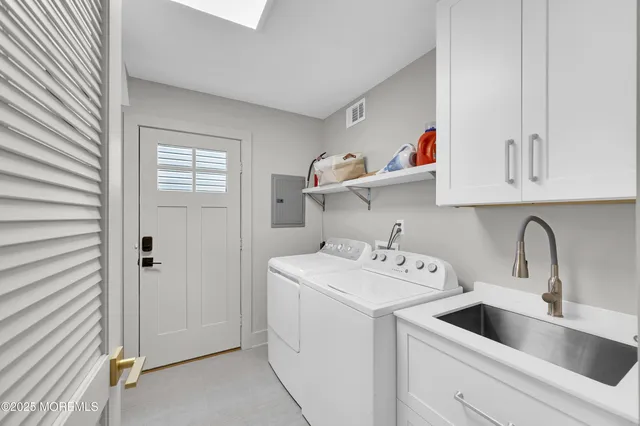 a view of a balcony with dining table and chairs