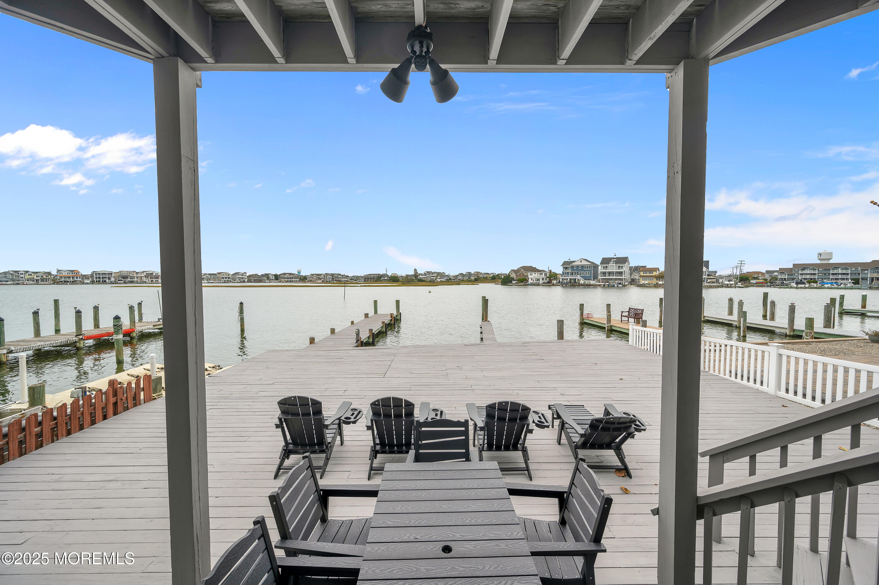 28 Harborside Drive East Seaside Heights, NJ 08751 - Photo 25 of 34 a view of a balcony with dining table and chairs