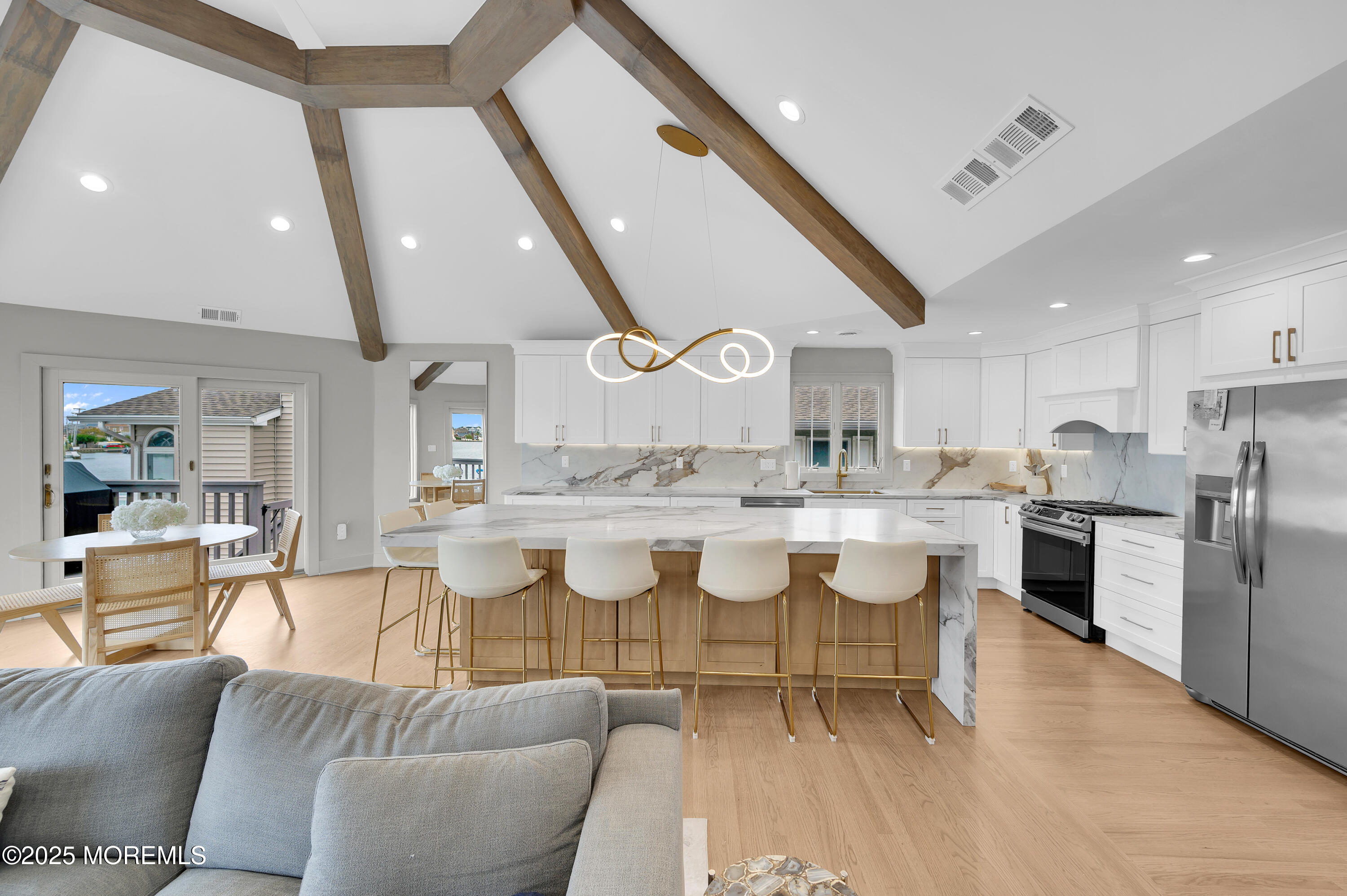 28 Harborside Drive East Seaside Heights, NJ 08751 - Photo 4 of 34 a large kitchen with a table and chairs