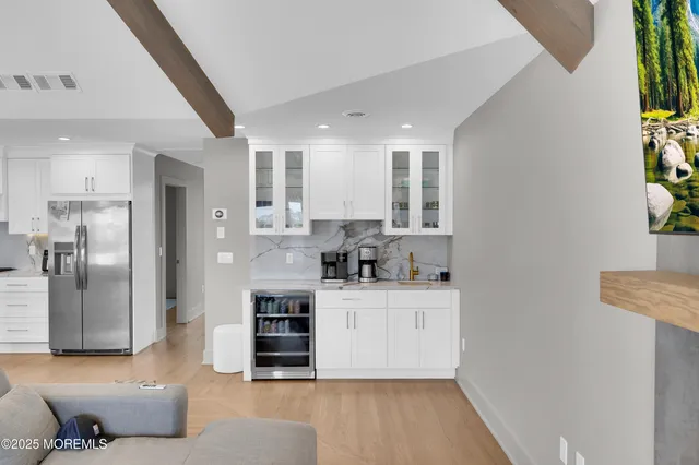 a view of a livingroom with furniture window and wooden floor