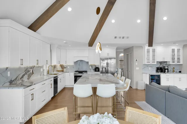 a living room with fireplace furniture and a flat screen tv