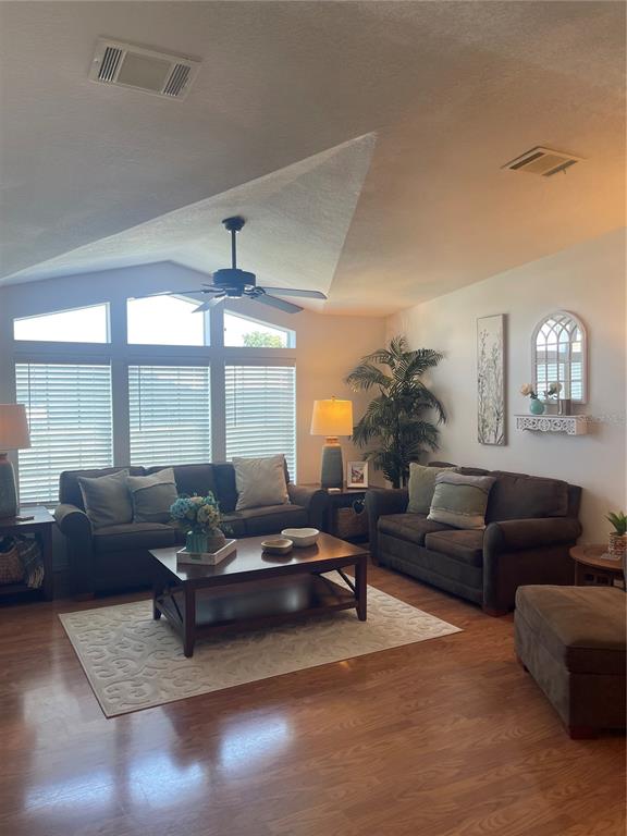 11200 Walsingham Road, Unit 139 Largo, FL 33778 - Photo 4 of 13 a living room with furniture and a large window