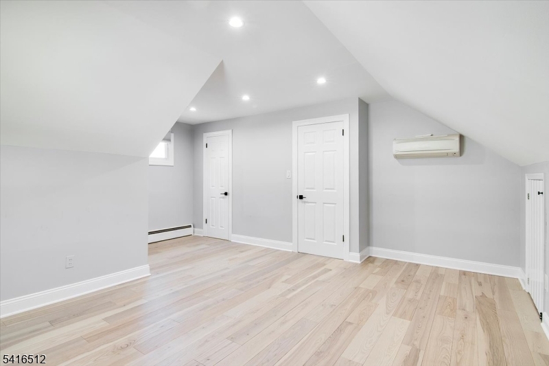 565 Center Street Wood-Ridge, NJ 07075 - Photo 15 of 26 wooden floor in an empty room with a window
