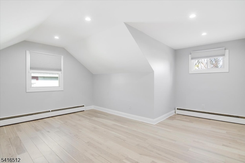 565 Center Street Wood-Ridge, NJ 07075 - Photo 16 of 26 wooden floor in an empty room with a window