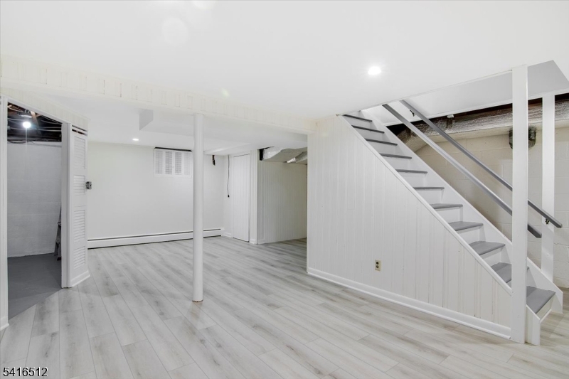 565 Center Street Wood-Ridge, NJ 07075 - Photo 17 of 26 a view of empty room with wooden floor