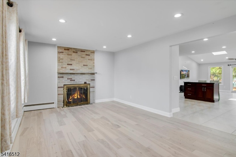 565 Center Street Wood-Ridge, NJ 07075 - Photo 2 of 26 a view of an empty room with a fireplace