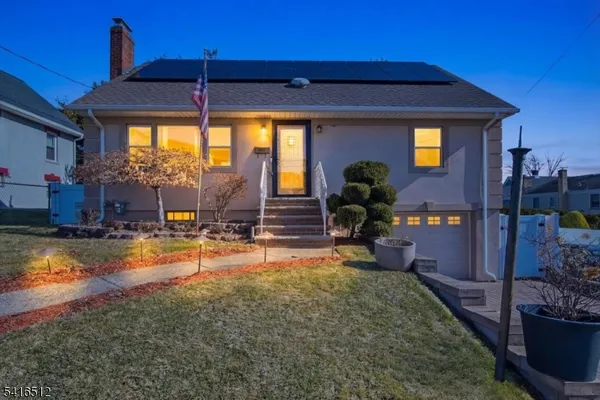 a view of a house with swimming pool and sitting area