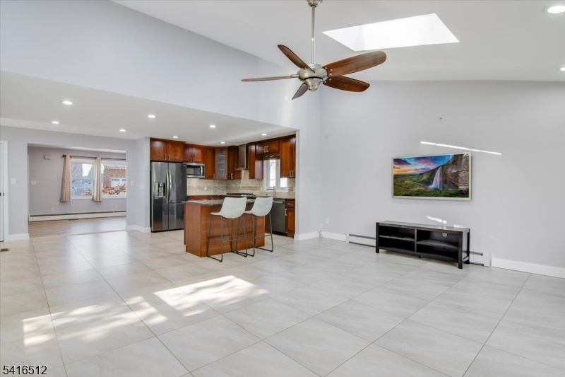 565 Center Street Wood-Ridge, NJ 07075 - Photo 5 of 26 a living room with furniture and kitchen view