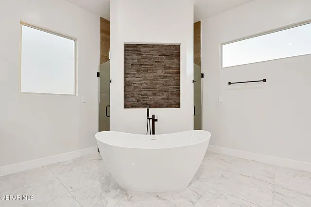 a white bath tub sitting in a bathroom
