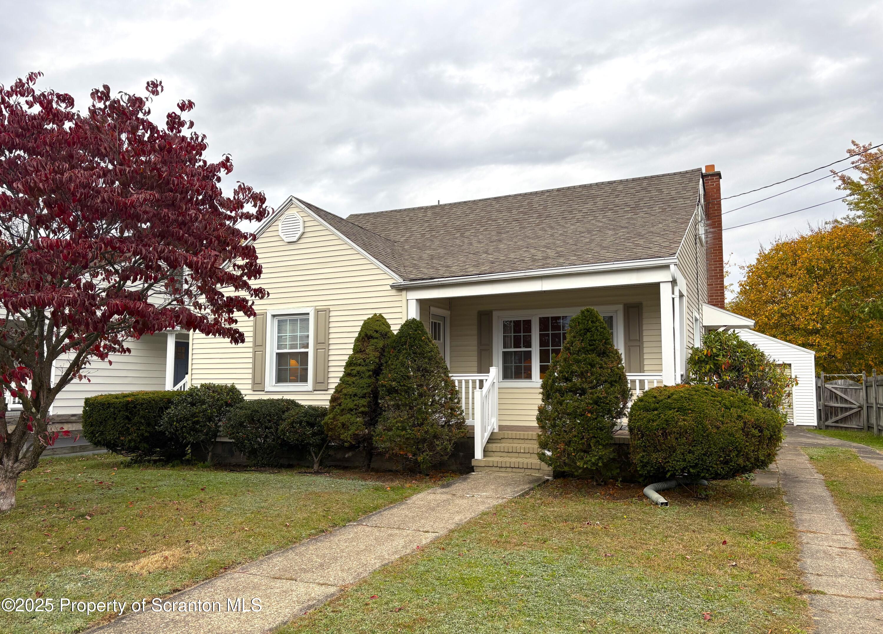 133 Corcoran Street Old Forge, PA 18518 - Photo 1 of 12 a view of a house with backyard and garden