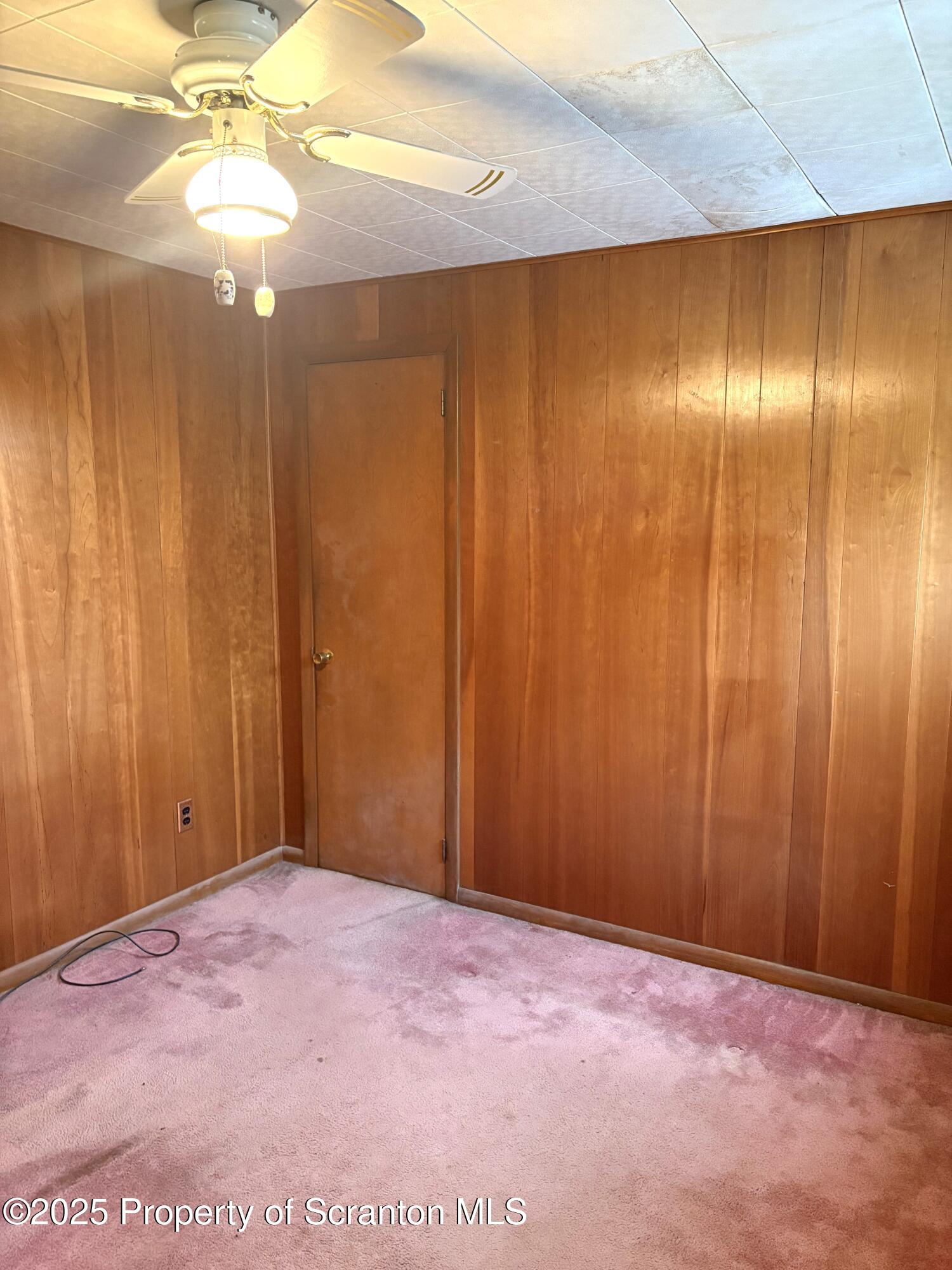 133 Corcoran Street Old Forge, PA 18518 - Photo 8 of 12 a view of an empty room with a window