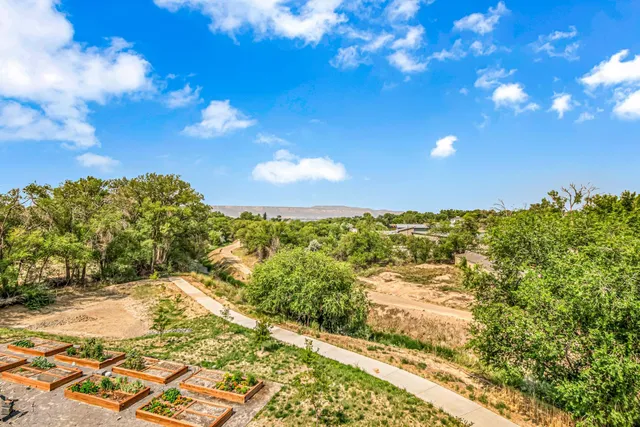 a view of a building with outdoor seating