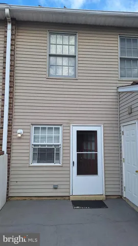 a view of front door and a window