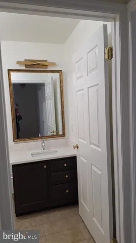 a bathroom with a sink a vanity and a mirror