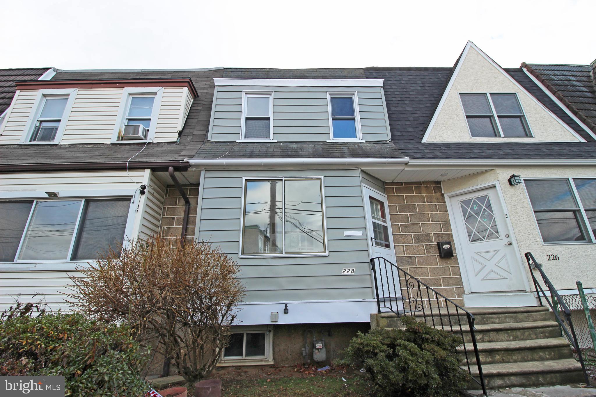 228 Guilford Road Lansdowne, PA 19050 - Photo 1 of 54 a view of a house with a door