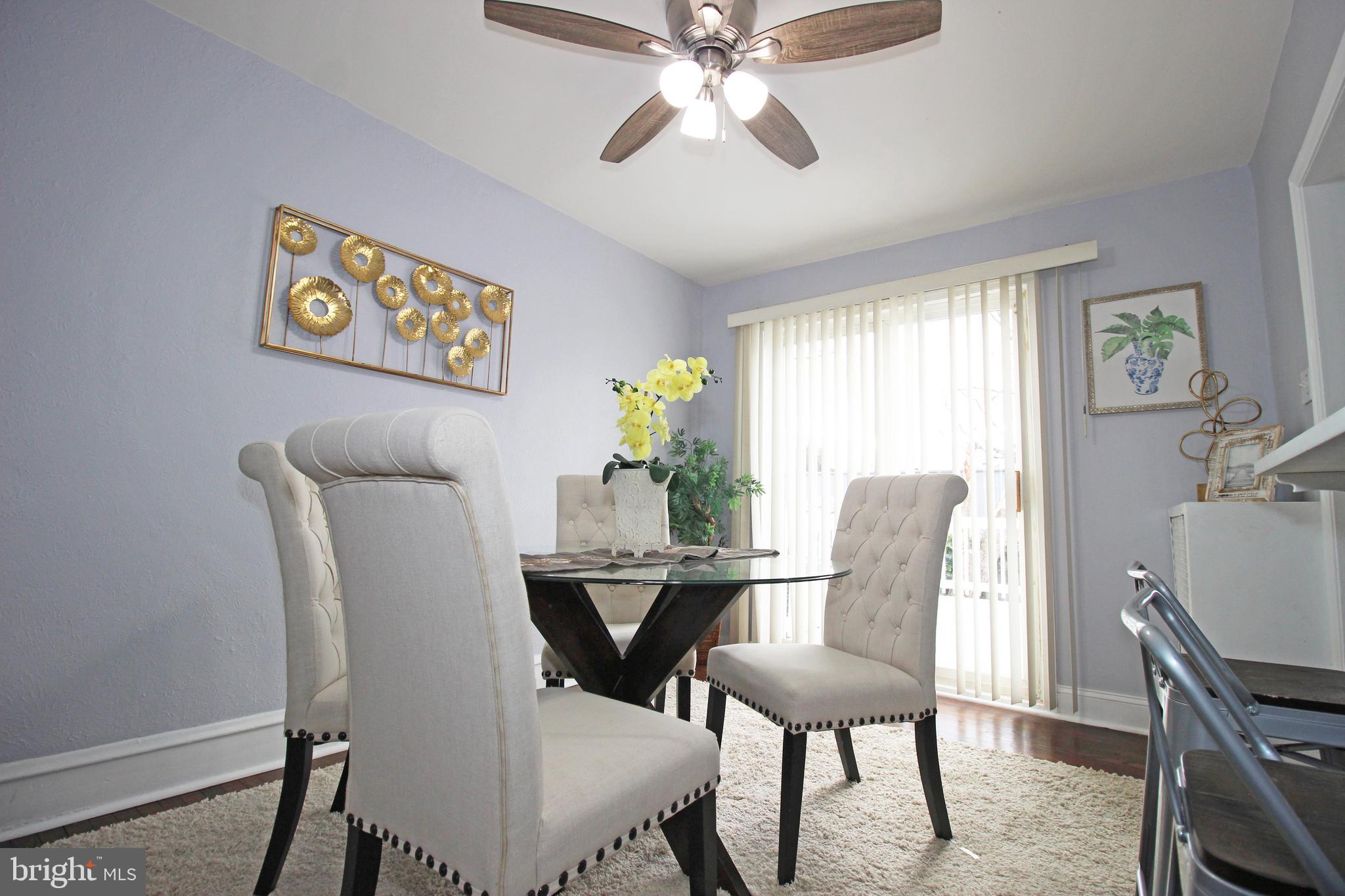 228 Guilford Road Lansdowne, PA 19050 - Photo 17 of 54 a view of a dining room with furniture and a chandelier