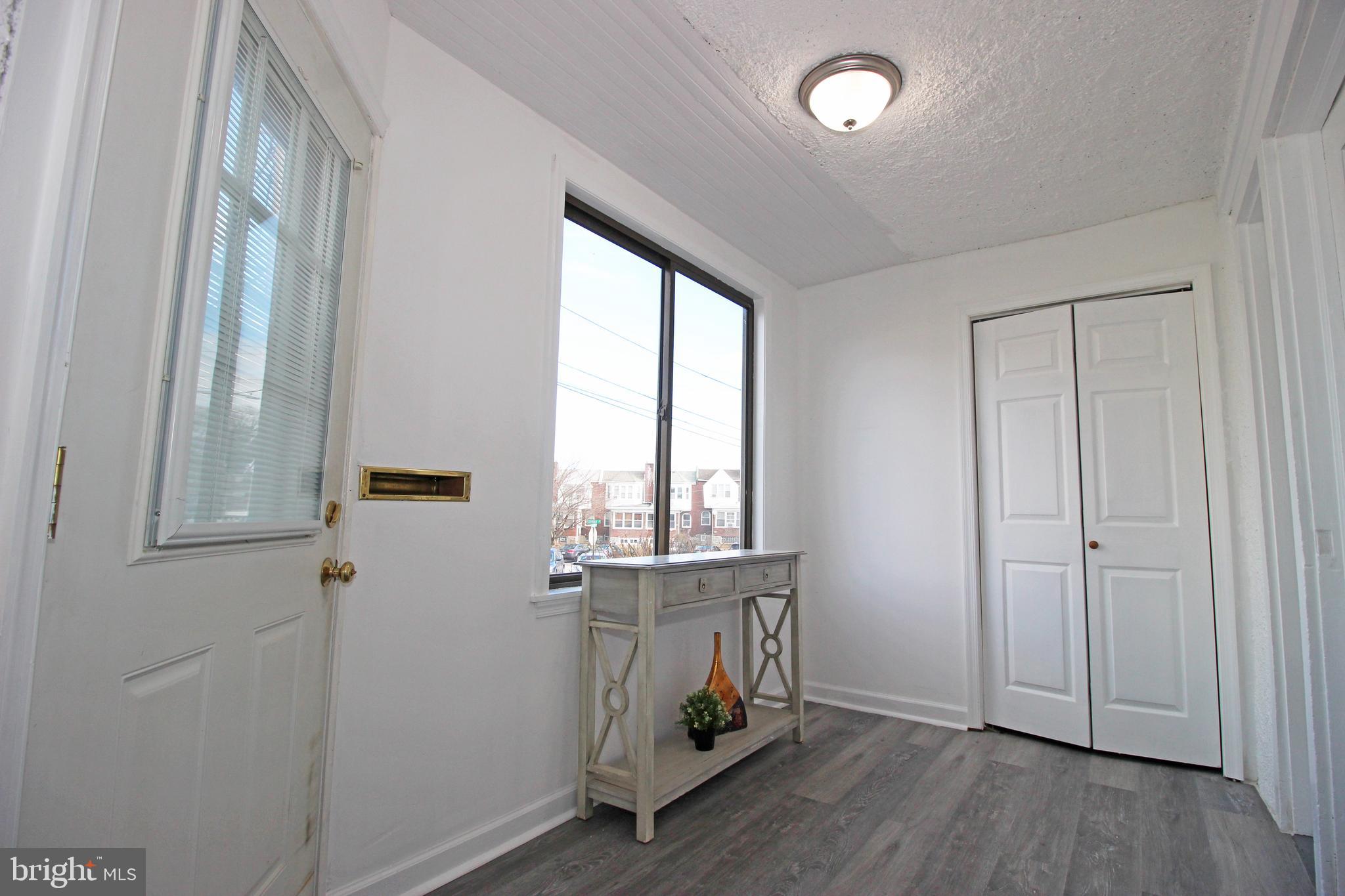 228 Guilford Road Lansdowne, PA 19050 - Photo 6 of 54 an empty room with wooden floor and windows