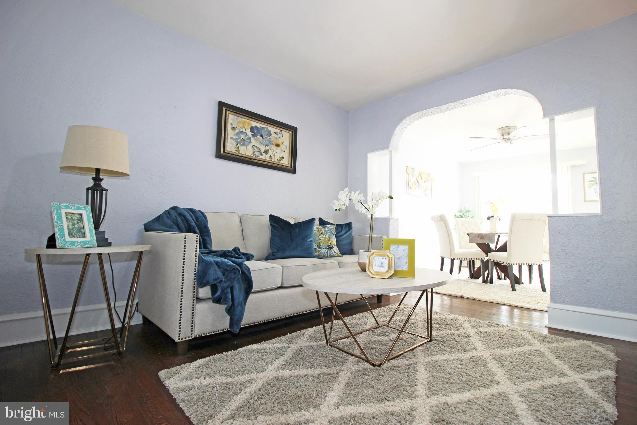 228 Guilford Road Lansdowne, PA 19050 - Photo 9 of 54 a living room with furniture and a large window