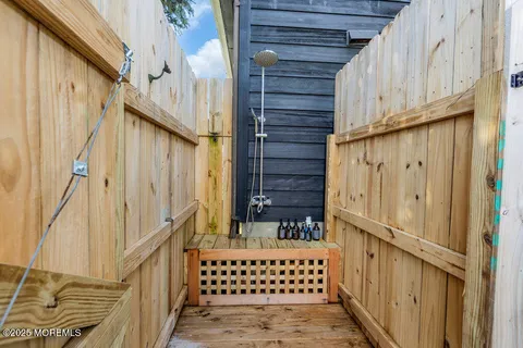 a view of a house with backyard porch and sitting area