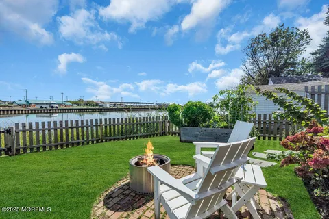 a view of a house with garden and porch