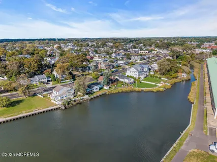 a picture of a bench in front of a wall