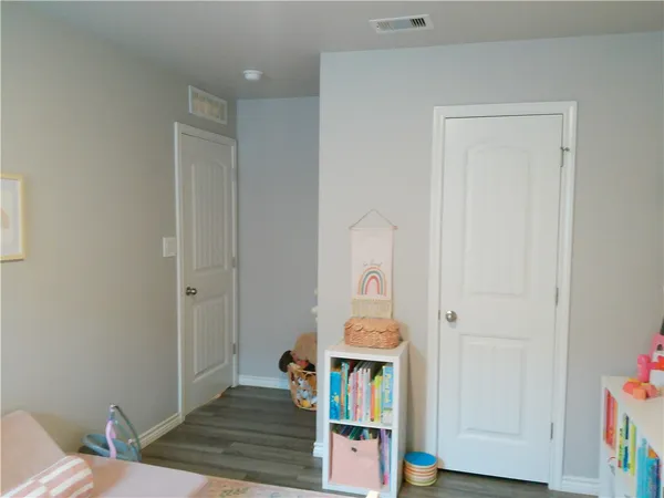 a room with furniture and a wooden floor