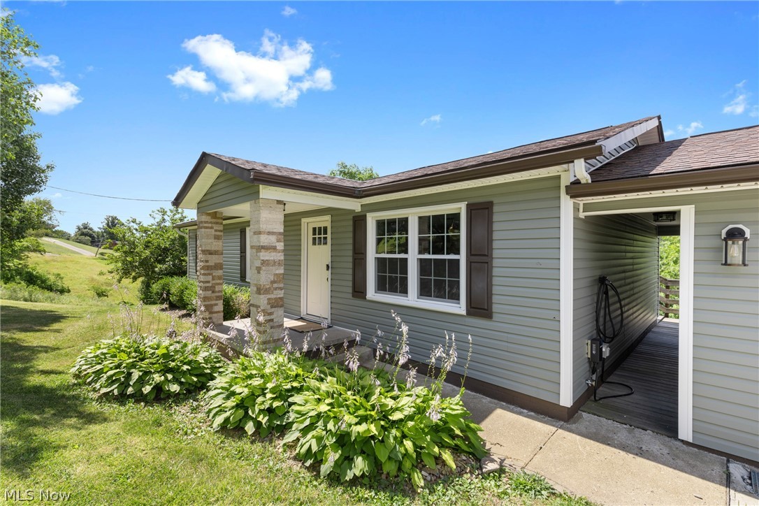 Ranch-style home with a front lawn