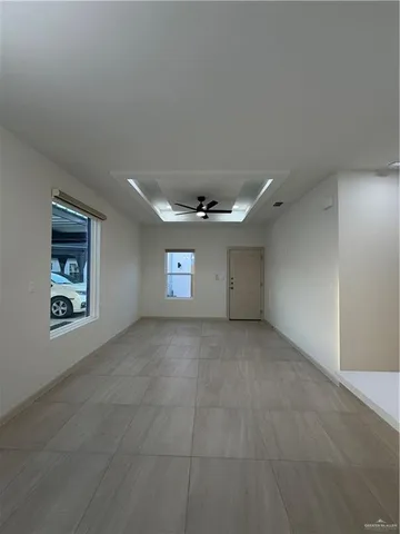 a view of an empty room and a window