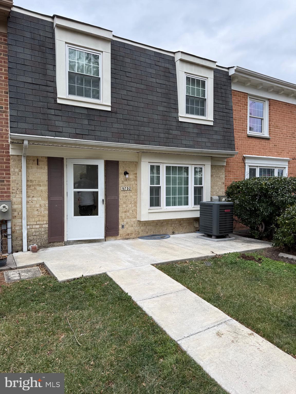 9753 Whiskey Run Laurel, MD 20723 - Photo 1 of 16 a front view of a house with a yard