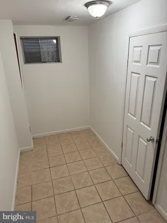 a view of a utility room with washing machine
