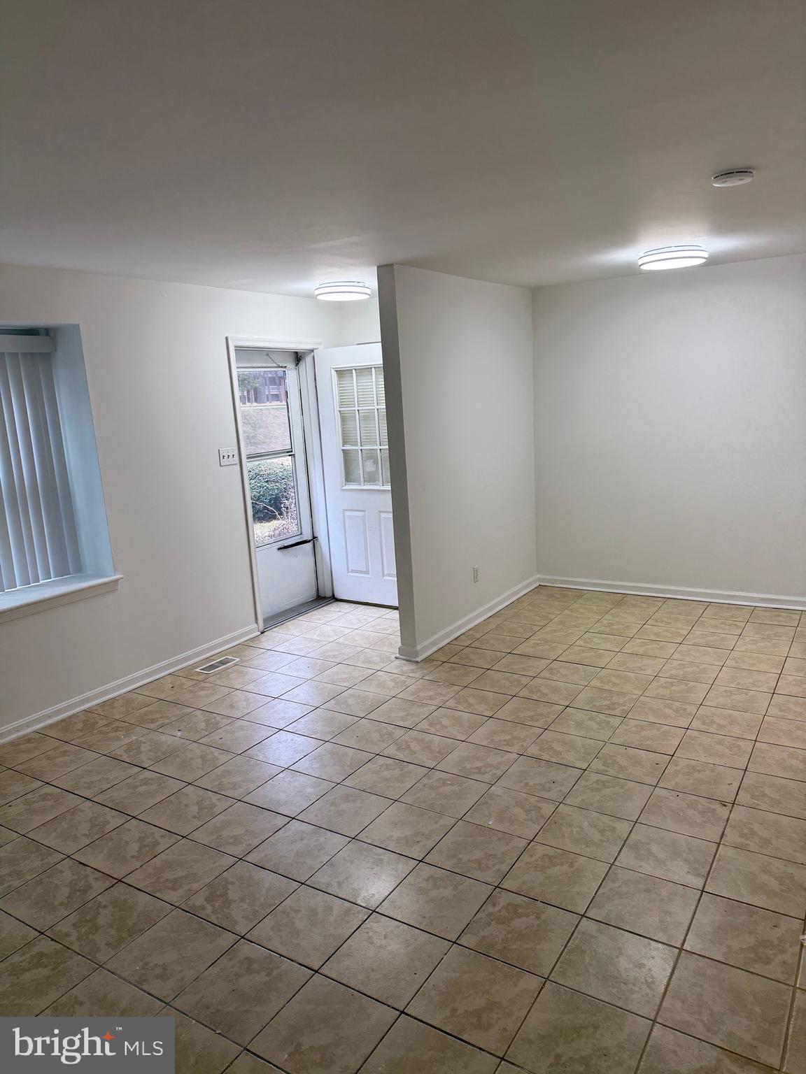 9753 Whiskey Run Laurel, MD 20723 - Photo 7 of 16 an empty room with windows