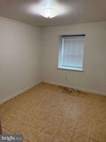 an empty room with a empty space and window