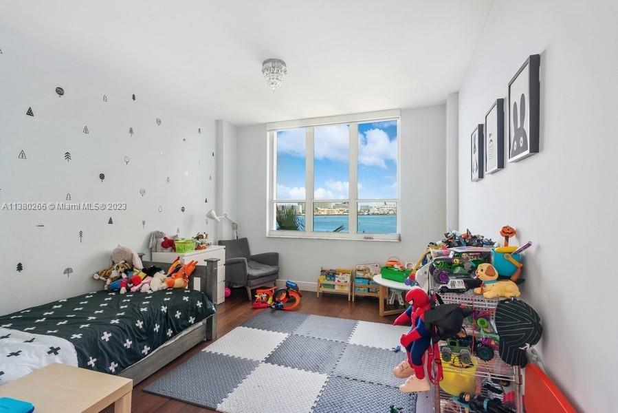 888 Brickell Key Drive, Unit 511 Miami, FL 33131 - Photo 12 of 26 a room with toys and toys