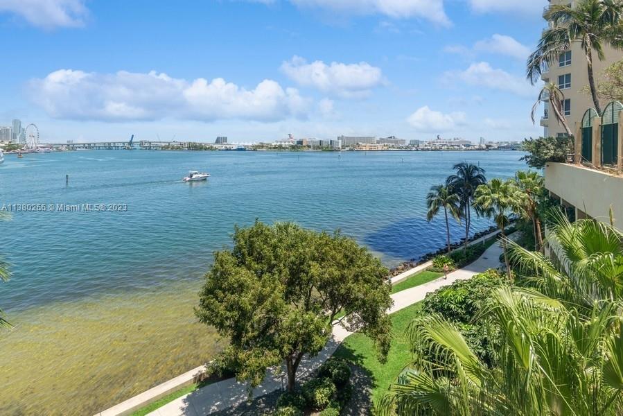 888 Brickell Key Drive, Unit 511 Miami, FL 33131 - Photo 17 of 26 a view of a lake with a yard