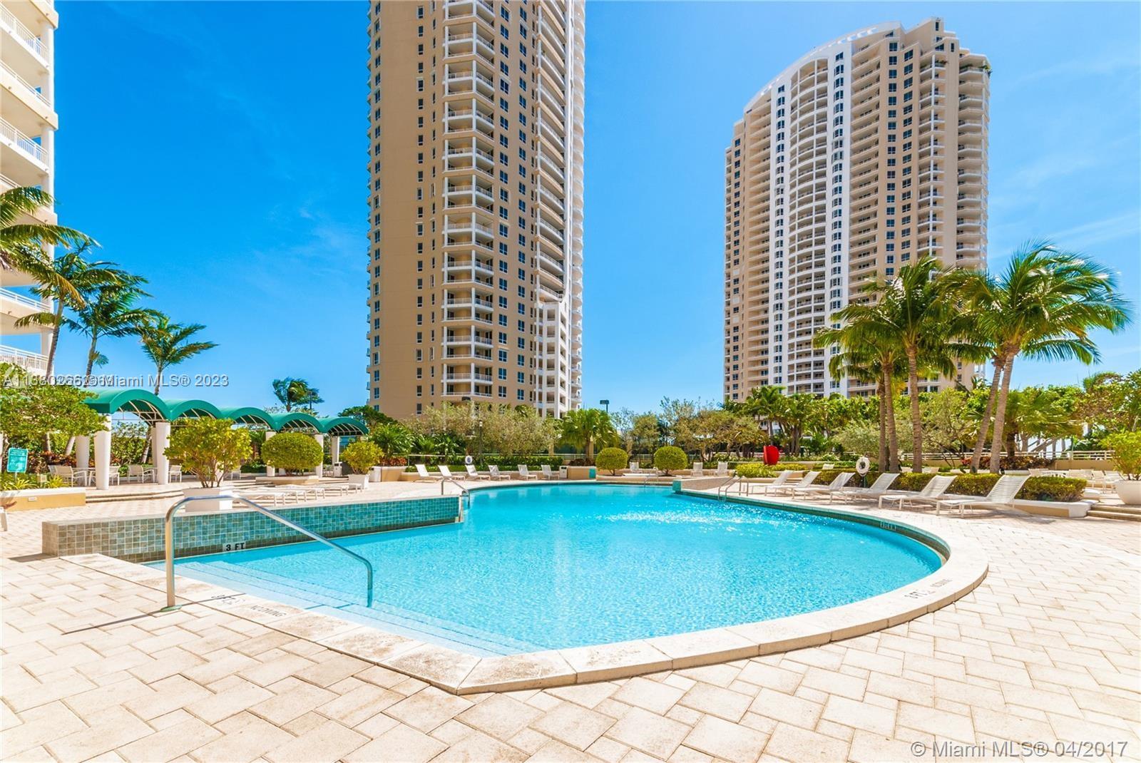 888 Brickell Key Drive, Unit 511 Miami, FL 33131 - Photo 18 of 26 a view of a swimming pool with chairs