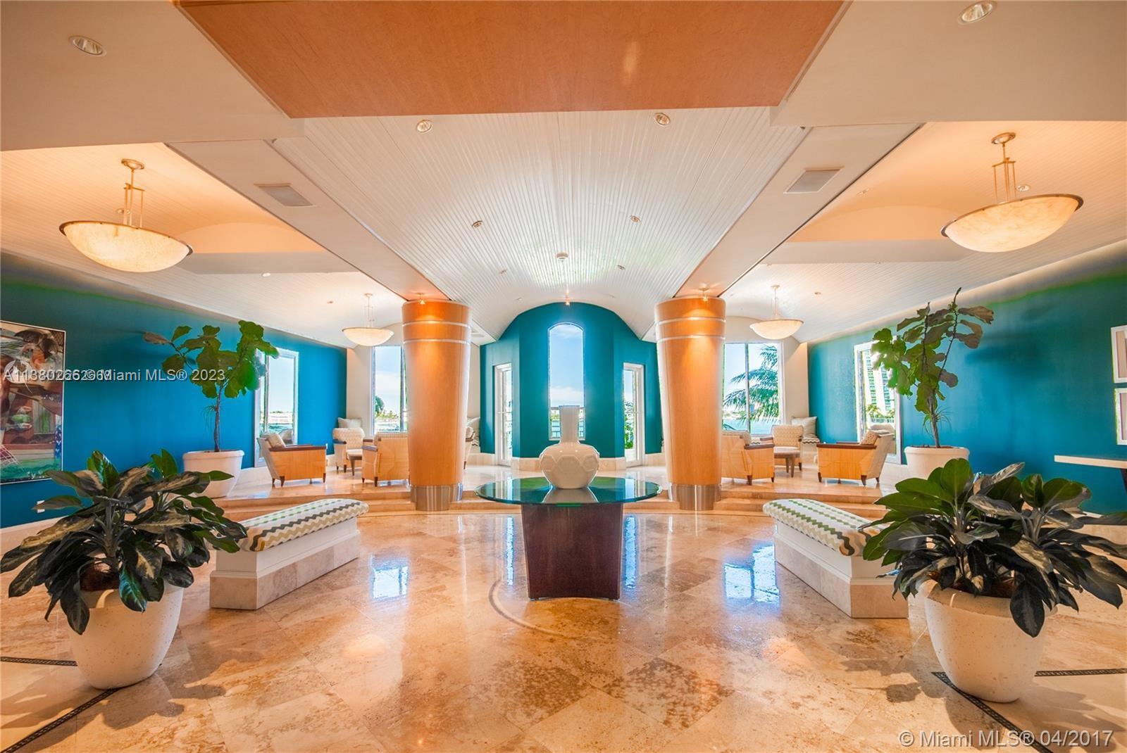 888 Brickell Key Drive, Unit 511 Miami, FL 33131 - Photo 25 of 26 a living room with furniture and a large window