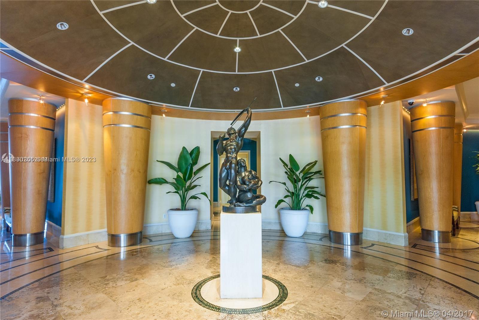 888 Brickell Key Drive, Unit 511 Miami, FL 33131 - Photo 26 of 26 a dining room with furniture and a potted plant