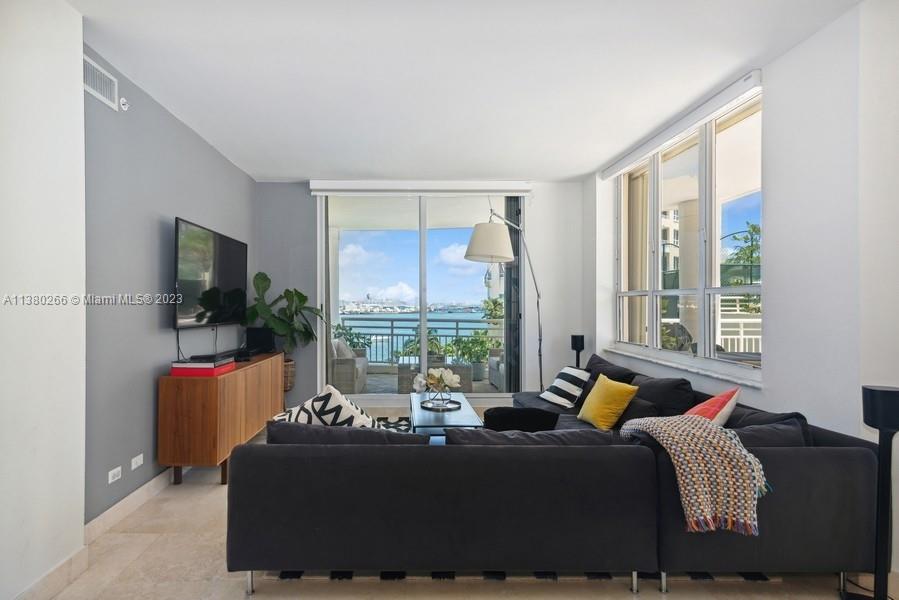 888 Brickell Key Drive, Unit 511 Miami, FL 33131 - Photo 5 of 26 a bed room with a bed and a balcony