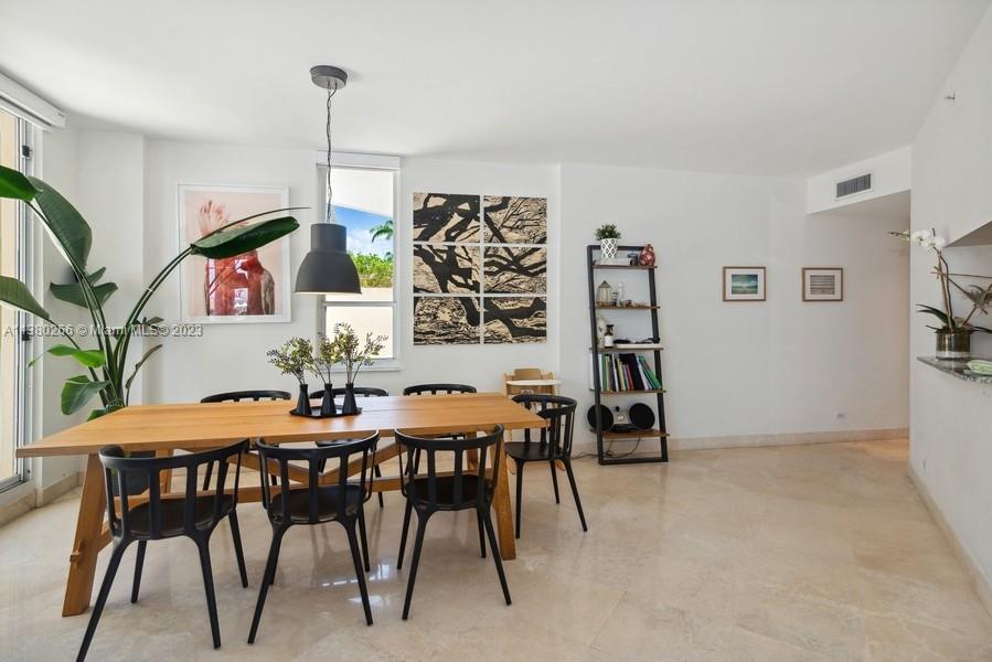 888 Brickell Key Drive, Unit 511 Miami, FL 33131 - Photo 7 of 26 a view of a dining room with furniture