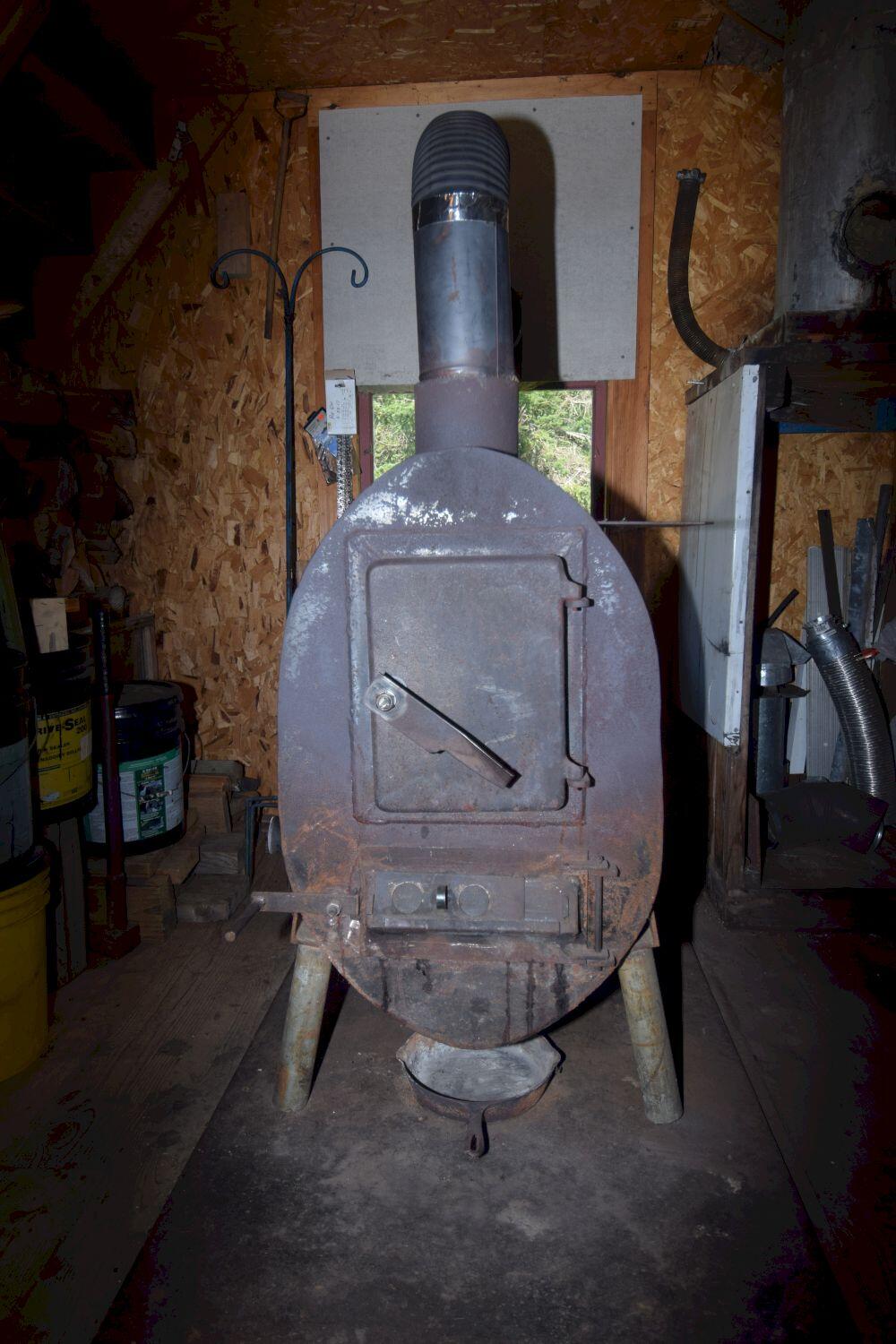 61 Castle Road Harmony, ME 04942 - Photo 68 of 82 Woodstove in workshop