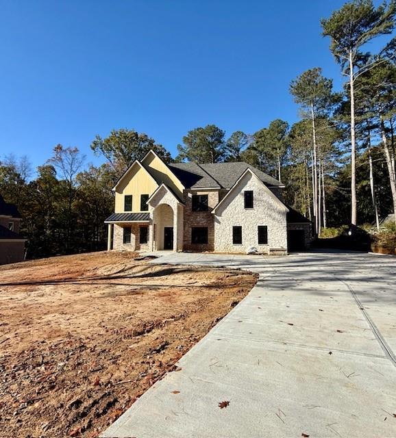 1258 Prospect Road Lawrenceville, GA 30043 - Photo 2 of 6 a view of white house with a big yard and palm trees