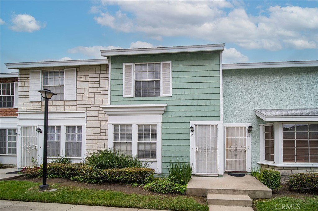 5640 Riverside Drive, Unit 35 Chino, CA 91710 - Photo 1 of 31 a front view of a house with garden
