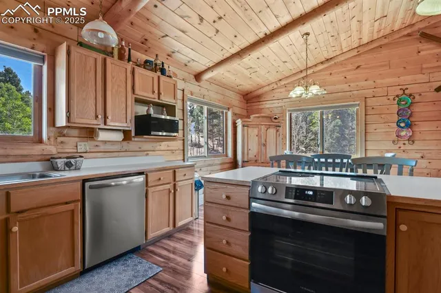 a kitchen with a stove and a sink
