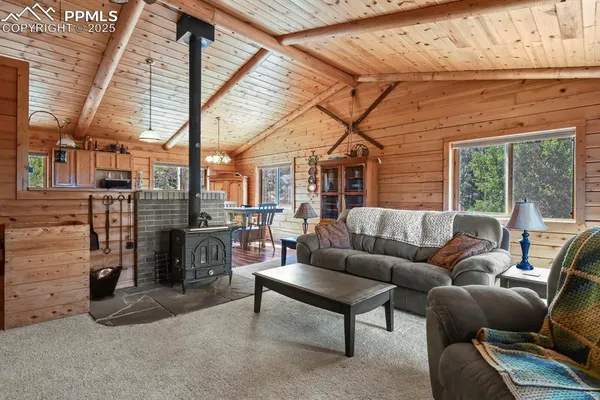 a outdoor living space with patio furniture and a fireplace