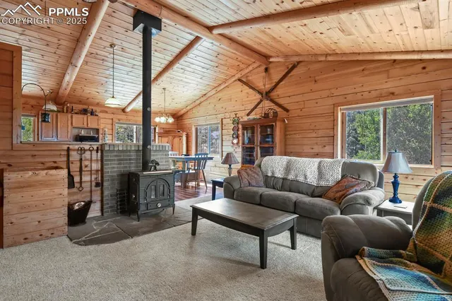 a outdoor living space with patio furniture and a fireplace