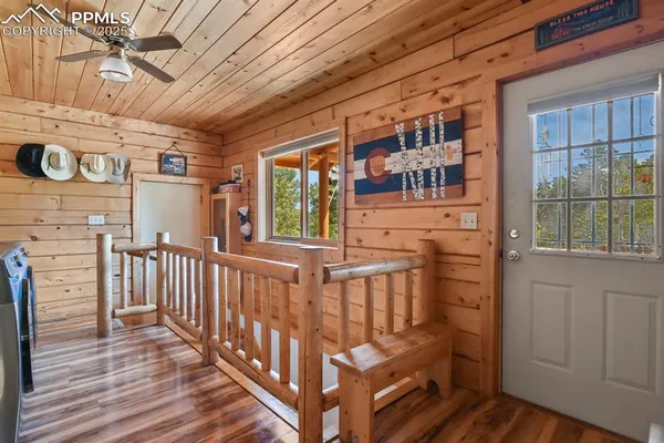 a view of a porch with wooden floor