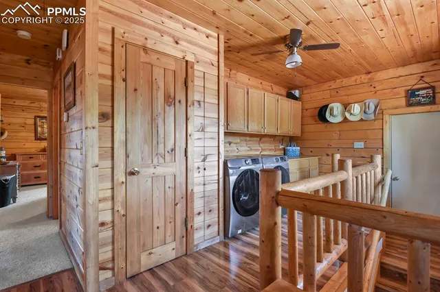 a view of a hallway with washer and dryer