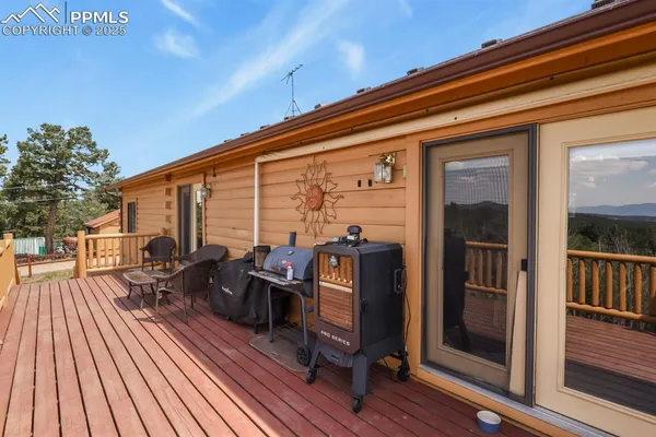 a view of living room with furniture and wooden floor