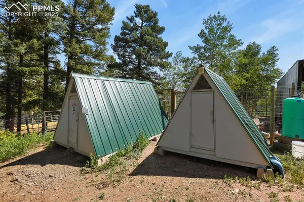 a view of backyard with a deck and a garden